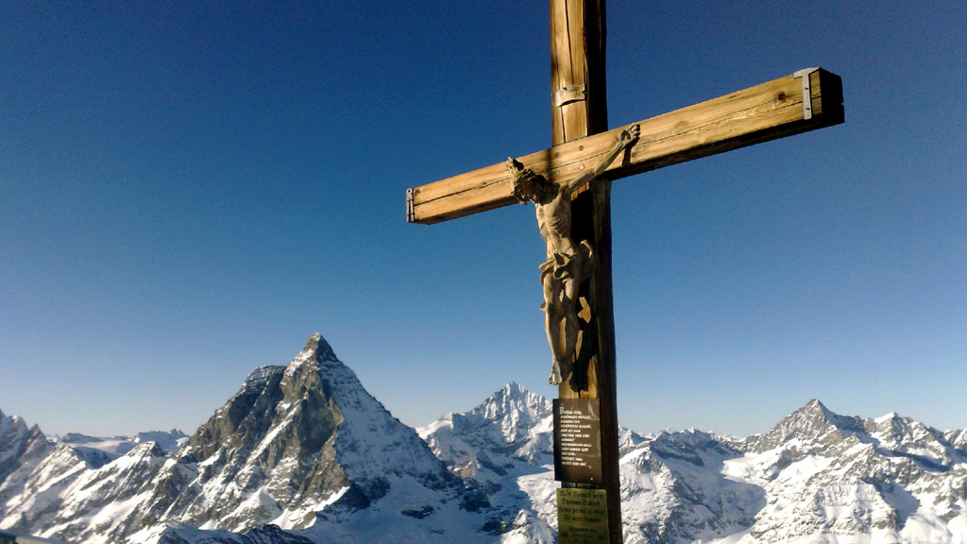 Gipfelkreuz Kleines Matterhorn - im Hintergrund Grosses Matterhorn