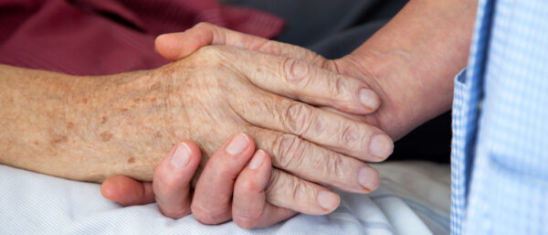 An der Hand eines Menschen aus dem Leben gehen. | Keystone