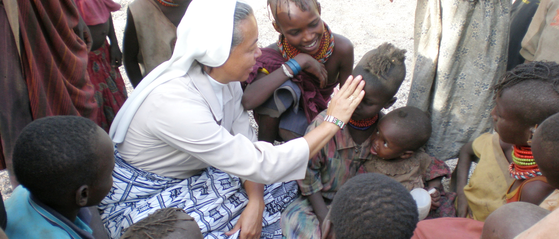 Health service: A nun offers her services to people in a Kenyan village.