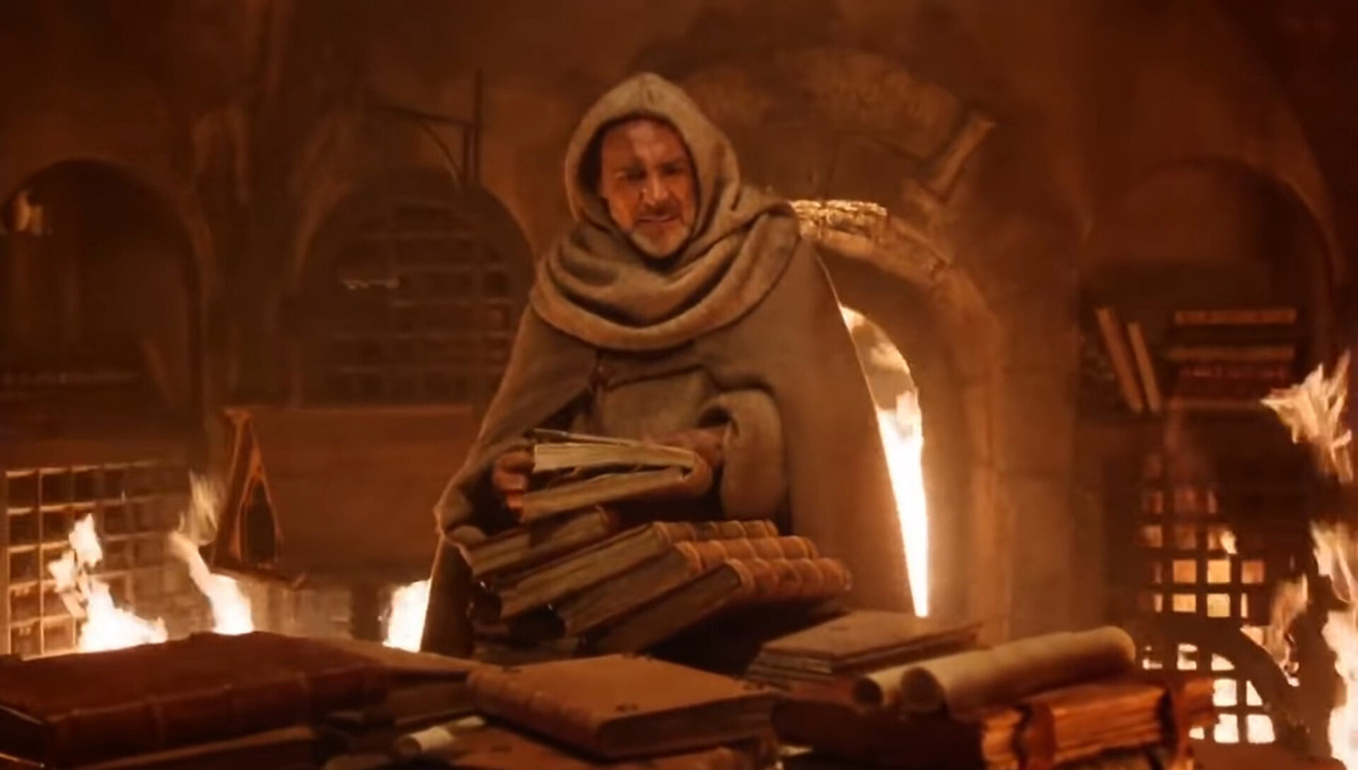 William von Baskerville (Sean Connery) rettet seltene Schriften aus der brennenden Klosterbibliothek. Screenshot «Der Name der Rose»