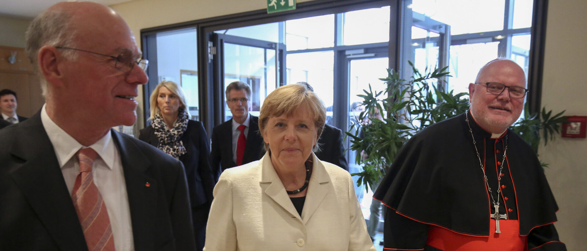 Norbert Lammert (links) mit Angela Merkel und Kardinal Reinhard Marx.